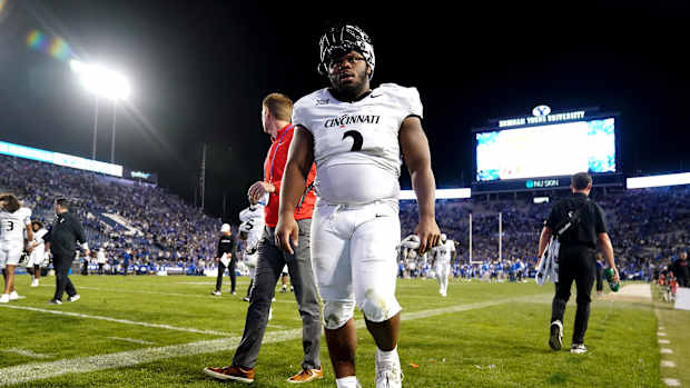 Cincinnati Bearcats defensive lineman Dontay Corleone (2) and the Cincinnati Bearcats walk off the field at the conclusion of a college football game between the Brigham Young Cougars and the Cincinnati Bearcats, Saturday, Sept. 30, 2023, at LaVell Edwards Stadium in Provo, Utah.